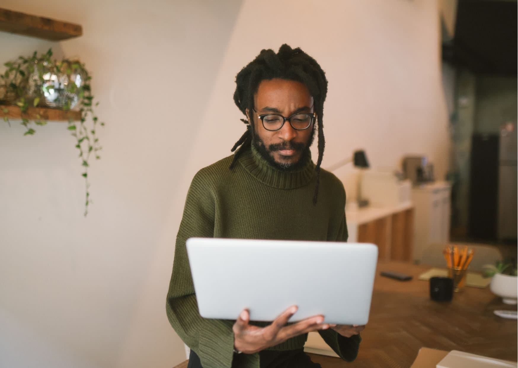 A Kiotapay agent working at a laptop